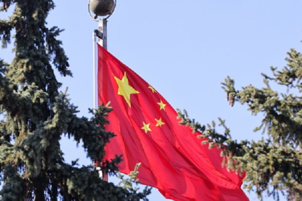 Флаг КНР. Фото Сергея Карпухина/ТАСС